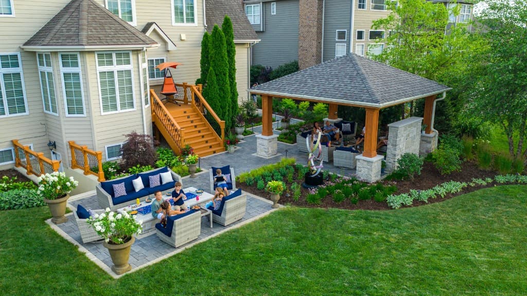 Spacious landscaped backyard with patio, lawn, and outdoor living
